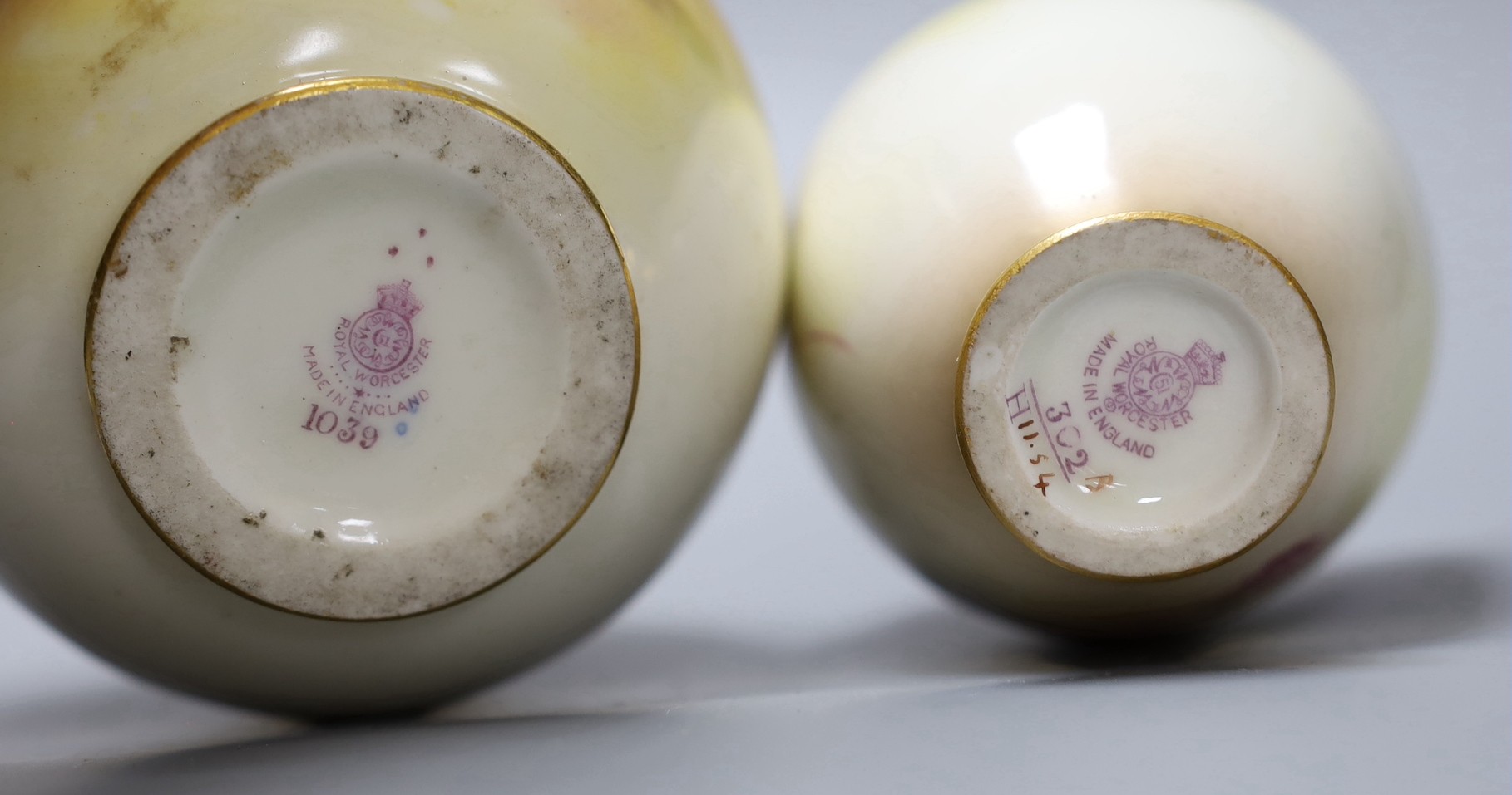 Two hand painted Royal Worcester vases, the taller signed K.Blake, the other signed H.Price, tallest 13cm